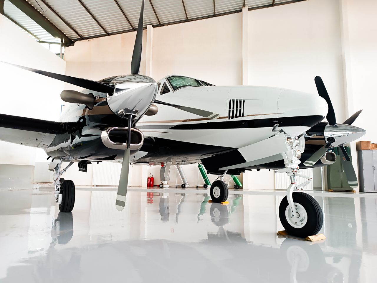 Mastering the First Impression: Your intriguing post title goes here Sleek private airplane with chrome details in a bright, clean hangar.
